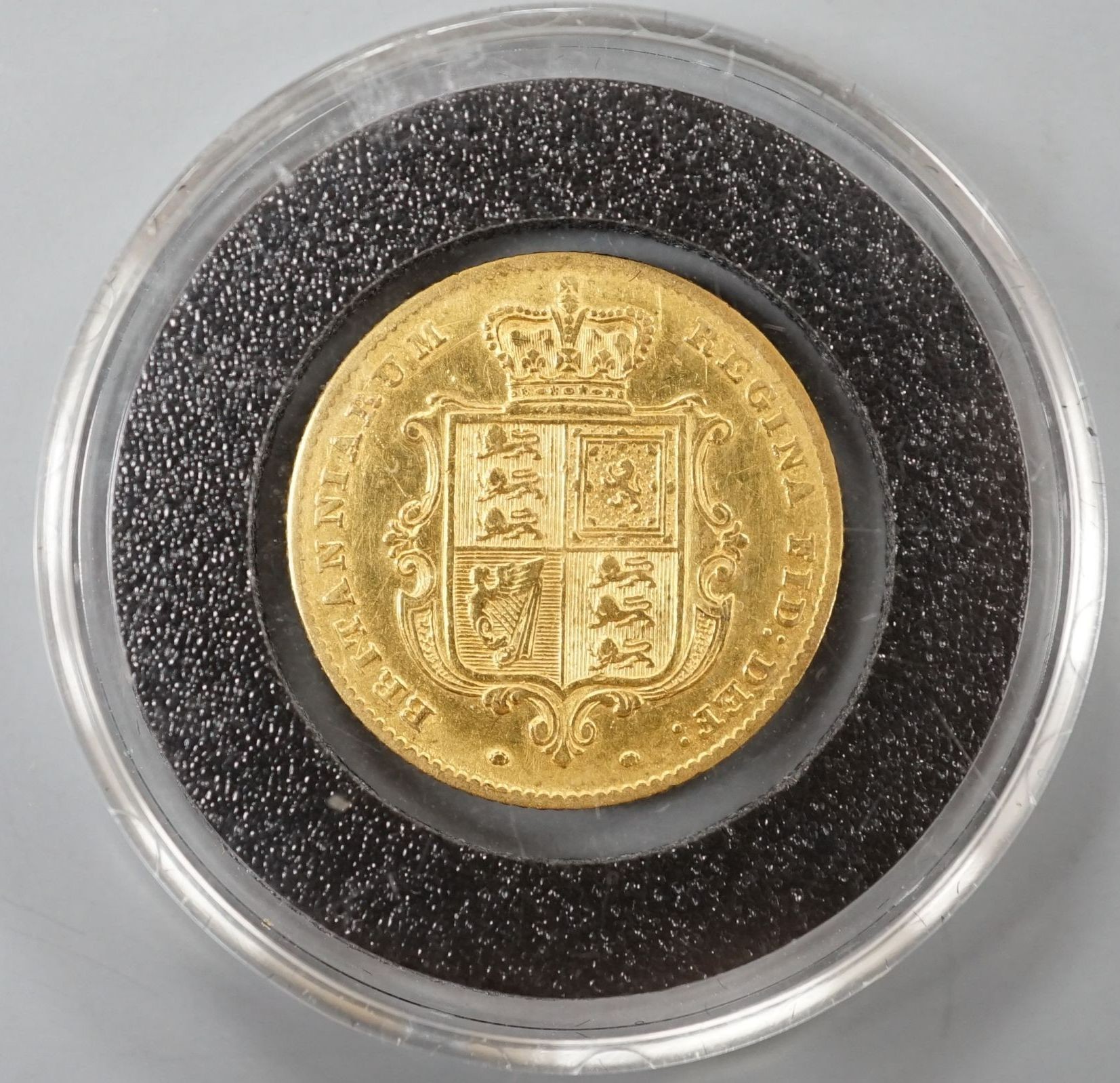 An 1842 gold half sovereign, mount marks otherwise good F.